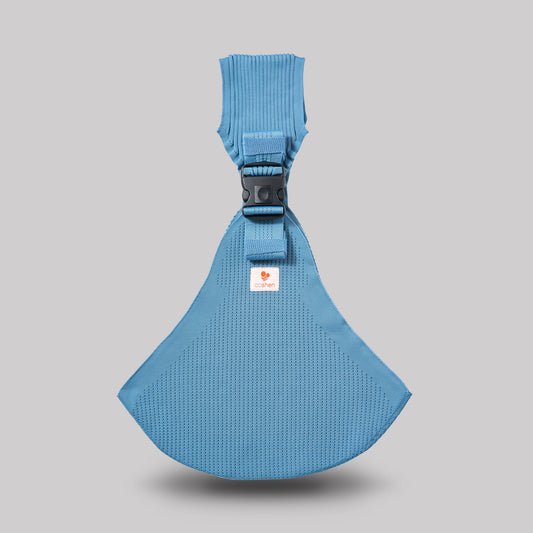 Coshen seamless 3D knit baby carrier in vibrant coral blue, featuring a modern ergonomic front view and healthy M-position seating.