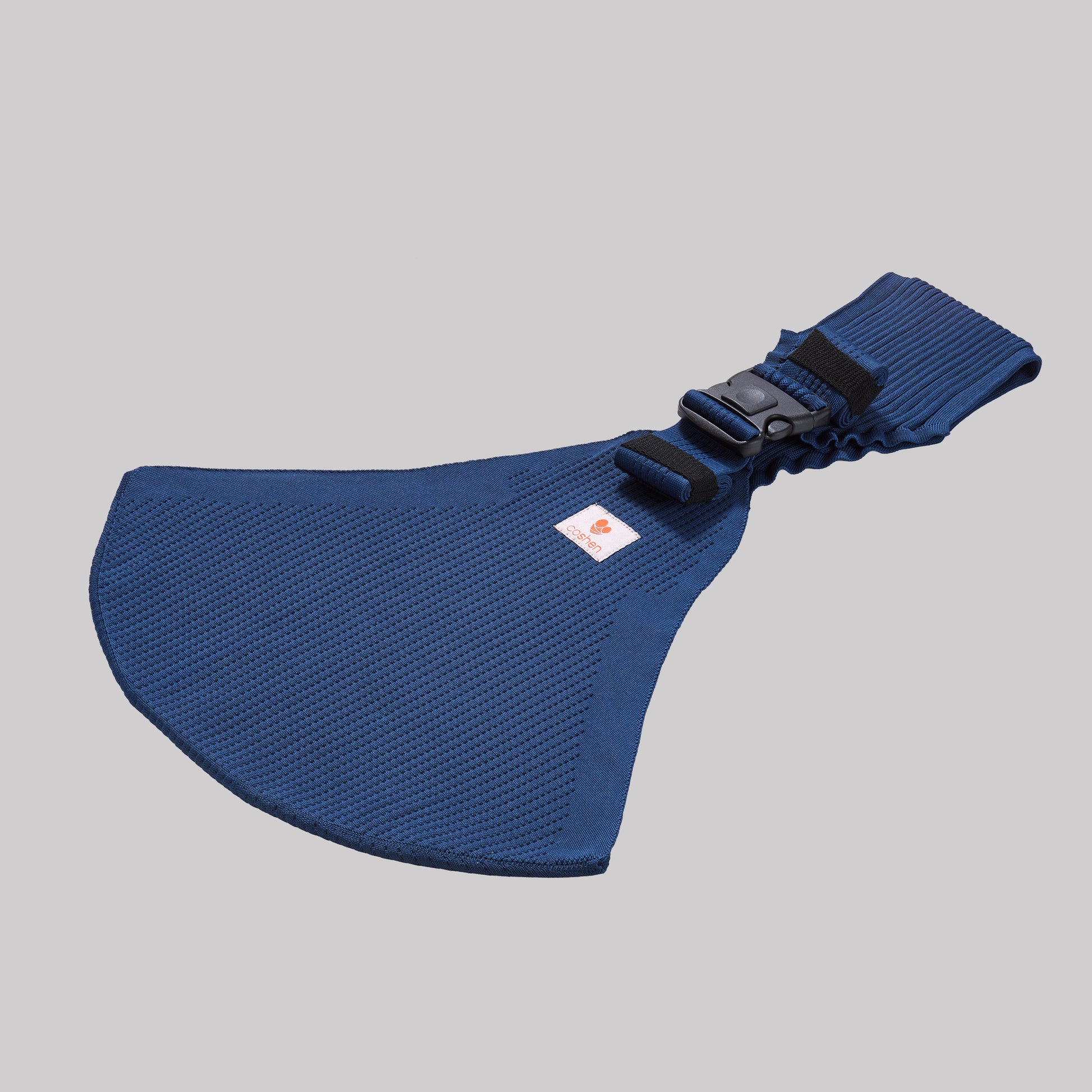 Angled perspective view of the navy blue Coshen carrier, highlighting the breathable 3D knit textile and contoured shoulder support for parent comfort.