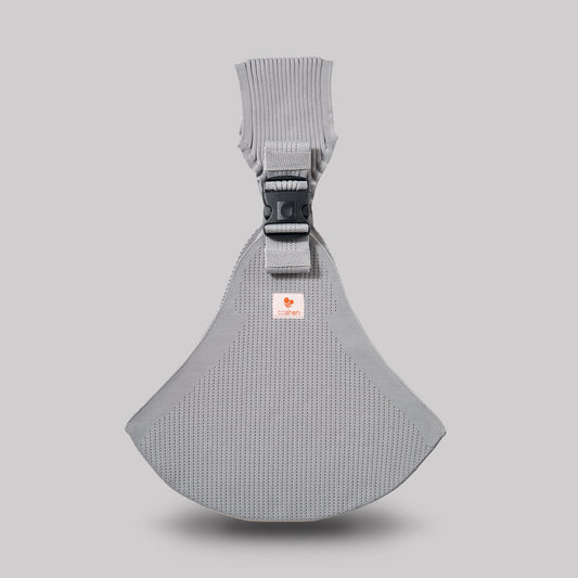 Angled perspective view of the silver Coshen carrier, highlighting the advanced 3D knit technical textile and minimalist seamless design for stylish parents.