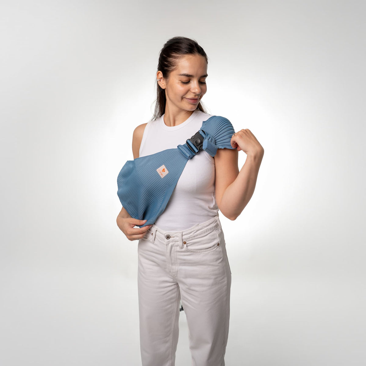 Coshen baby carrier user guide step 1: Loosen straps, pass over head, and position on torso.